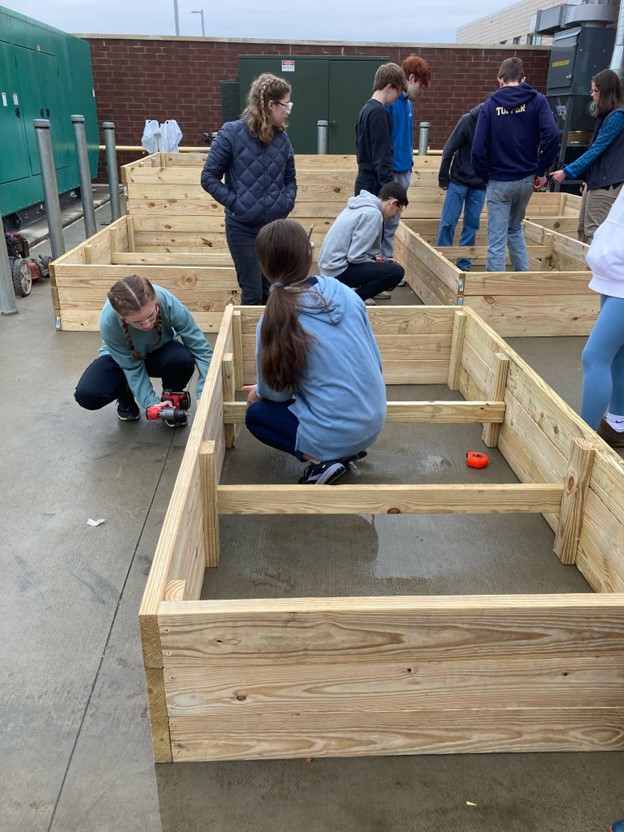 Intro to Ag Mech classes building the raised bed gardens for Edible Classroom.jpg